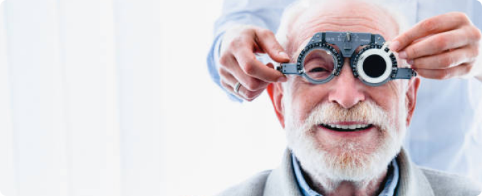 Low vision aids in Dubai with a patient testing vision using trial lenses at Aloka Eye Clinic